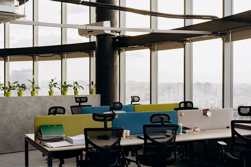 Empty rows of office desks in a modern workplace, reflecting record-low employee engagement — just 31% of U.S. workers engaged in 2026