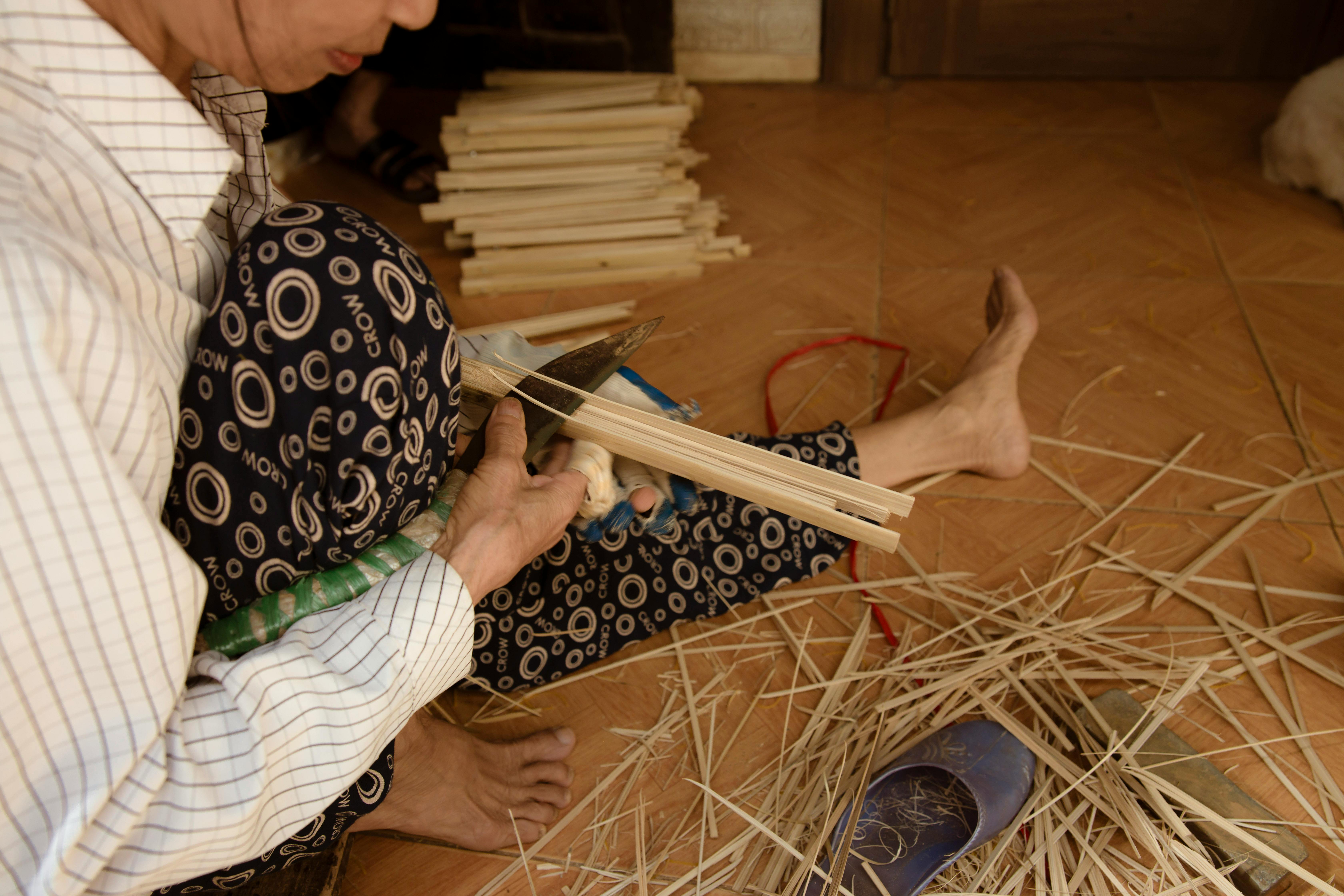 Close-up of a person's hands building or crafting something physical, representing the career advice to build an independent skill, business, or creative asset that exists outside any employer in the 2026 AI economy