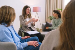 "Young person in therapy session discussing mental health and wellness"