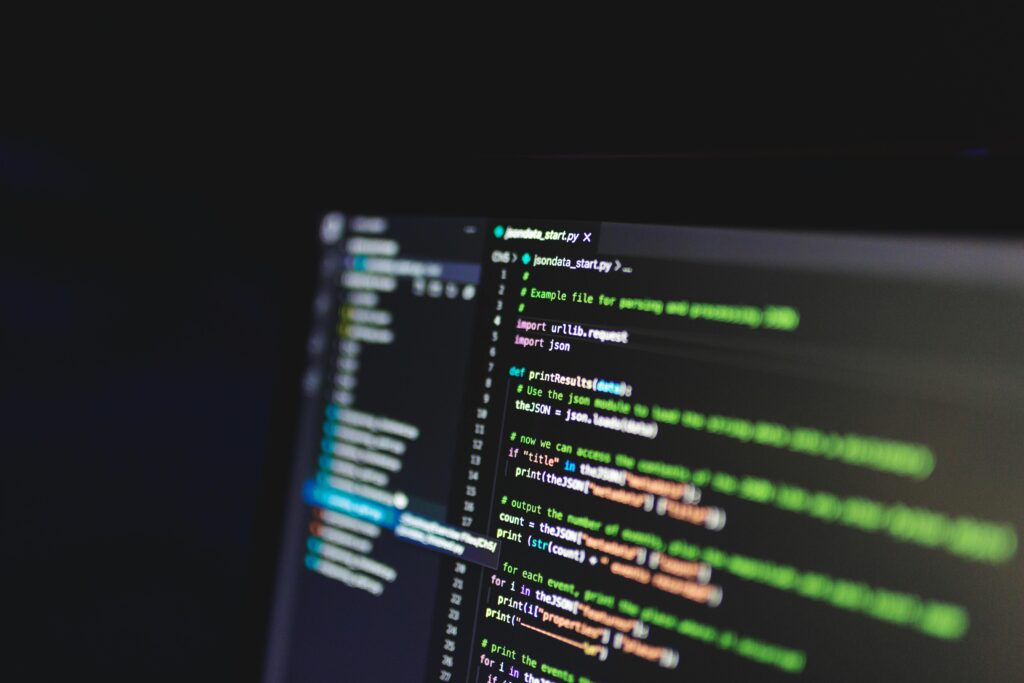 A dark laptop screen with data representing the RealPage rent-pricing algorithm that the DOJ sued for enabling landlords to coordinate rent increases across millions of American apartments, settling in November 2025 with zero damages paid