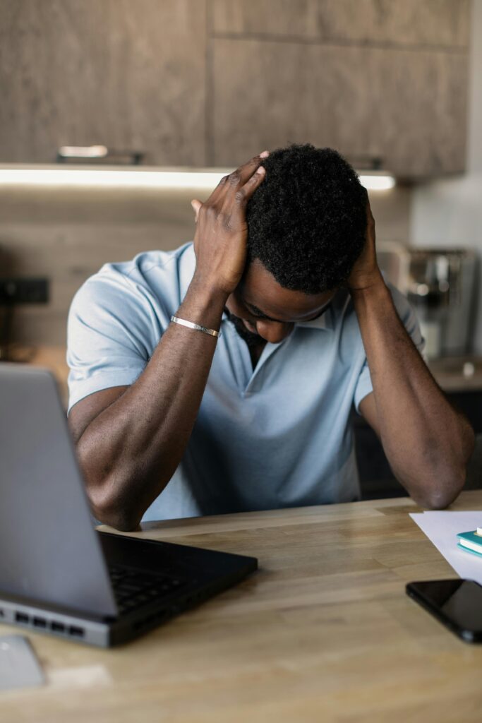Person working alone from home representing isolation caused by remote work culture