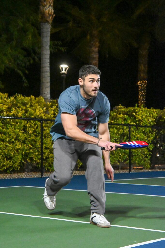 Pickleball player reacting quickly to a shot demonstrating cognitive and coordination benefits